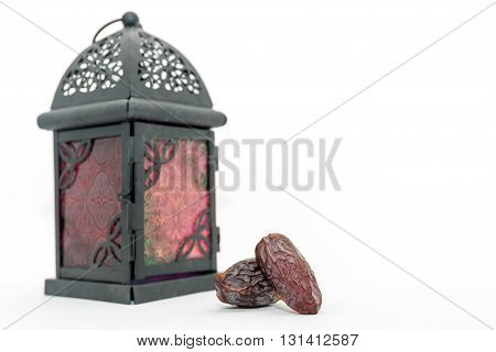 Date fruits and arabic lantern. Ramadan Eid concept