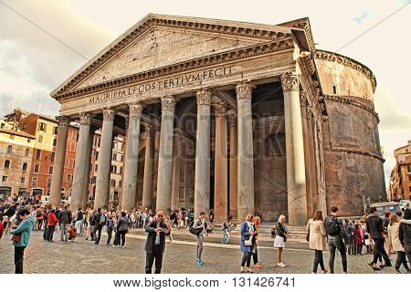 ROME ITALY - APRIL 9 2016: Tourists visit the Pantheon on APRIL 9 2016 in Rome Italy. Pantheon is a famous monument of ancient Roman culture the temple of all the gods built in the 2nd century.