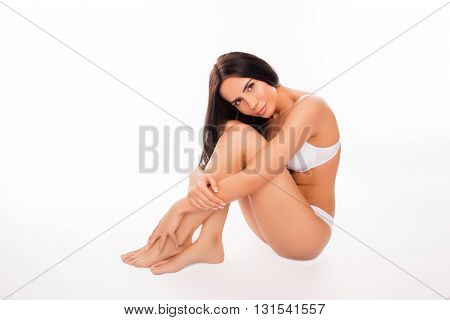 Portrait Of Shy Brunette With Slim Body On White Background