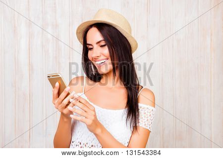 Happy Smiling Woman In Hat Chatting On Mobile Phone