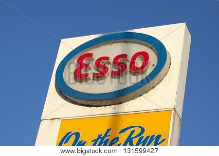 ENKHUIZEN, THE NETHERLANDS - 4 FEBRUARY 2015: white red and blue advertising sign of the esso with a blue sky in the background