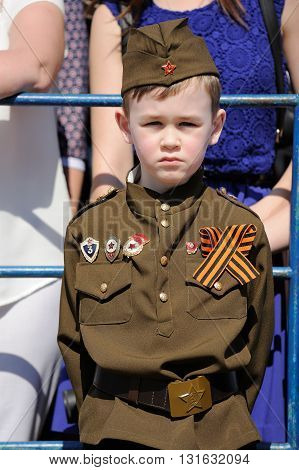 Orel Russia - May 9 2016: Celebration of 71th anniversary of the Victory Day (WWII). Kid in military uniform vertical