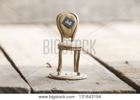 Job - inscription job and gold chair on the table