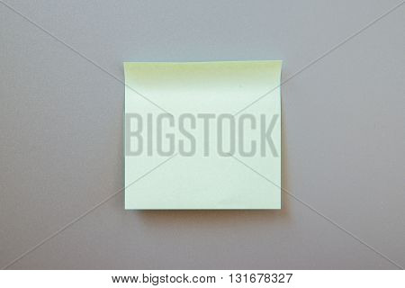 Blank adhesive note for inscription on a label. Front view