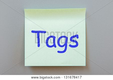 Adhesive note with inscription on a label. Front view