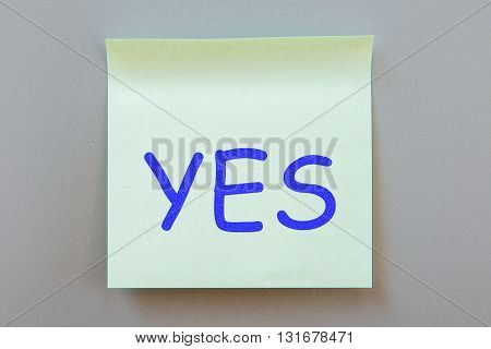 Adhesive note with inscription on a label. Front view