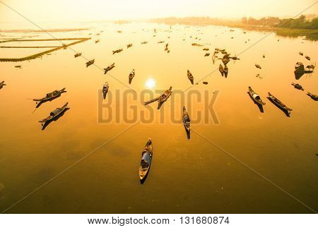 Boats in Tam Giang lagoon in sunrise from drone.Hue, Vietnam