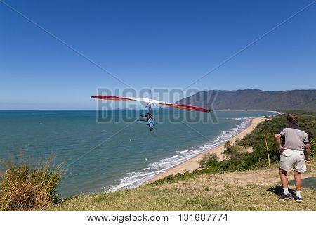 Port Douglas, Australia - April 27, 2015: Hang glider starting from from Trinity Bay lookout.