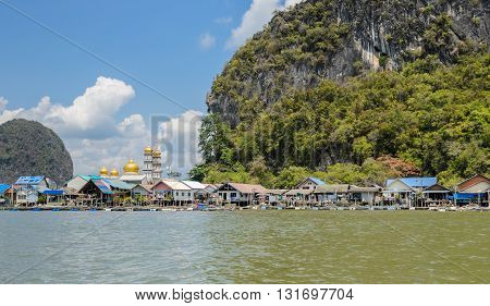 Landscape of limestone karsts of Phang Nga Bay National Park. Panyi island or Koh Panyee floating fishing village in Phang Nga Province Thailand