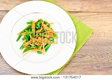 Green Beans with Carrots on Plate. Studio Phoro