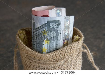 European euro notes in a hessian bag.