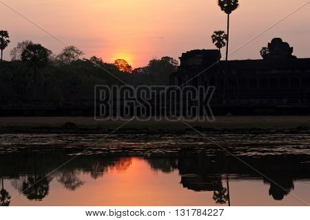 Reflections of Ankor Wat temple at dawn