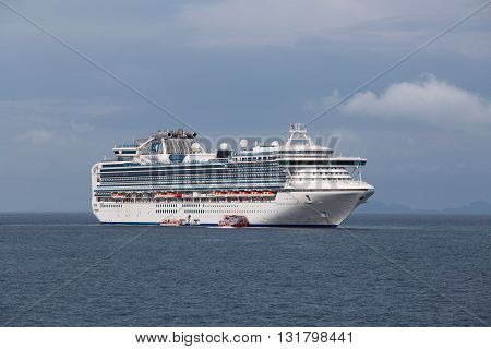 KOH SAMUI THAILAND - DECEMBER 09 2015 : Large cruise ship Sapphire Princess in sea water near island Koh Samui Thailand. Sapphire Princess was built in Japan and completed in 2004