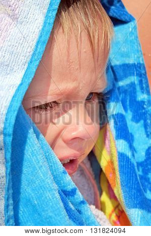 Sad Child Crying in the Bath Towel outdoor