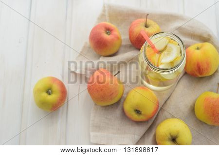 fresh rustic concept, apples on a white rag on the wooden background