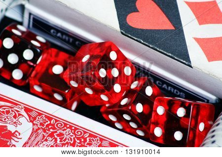 Cards and red dice poker on the table