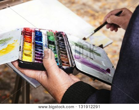 Artist painting watercolours People Leisure lifestyle outdoor
