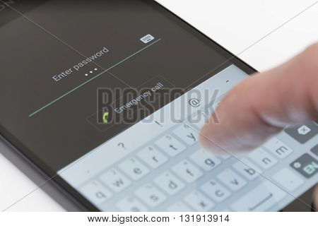 Melbourne, Australia - May 23, 2016: Entering password on the lock screen of an Android phone. The lock screen improves smartphone security, users can unlock their phone by entering password, pin or drawing pattern.