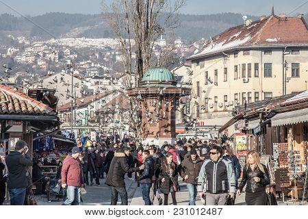 Sarajevo, Bosnia And Herzegovina - February 16, 2018: Pigeons Flying Over The Bascarsija Square Sebi