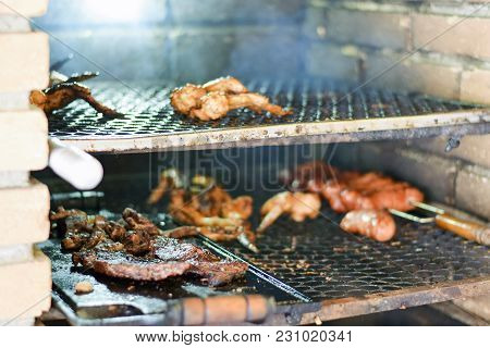 Brazilian Meat Grilling At A Churrasco On A Churrasqueira