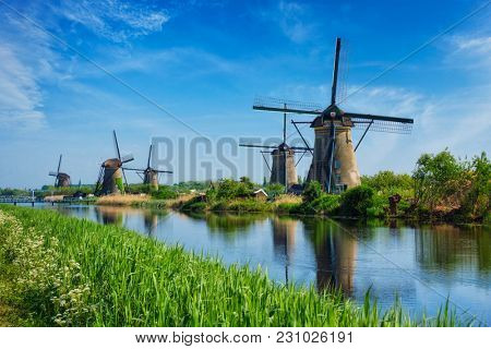 Netherlands rural lanscape with windmills at famous tourist site Kinderdijk in Holland