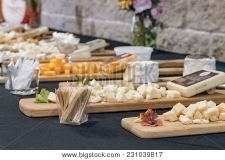 Cheese Samples Laid Out On Display Boards At A Local Creamery In Wisconsin