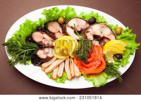 Red Fish Slices With Limon On The Table