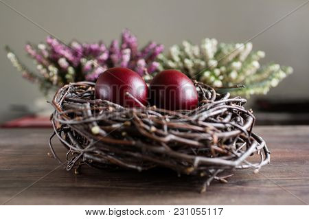 Easter Egg In The Nest On Grey Background