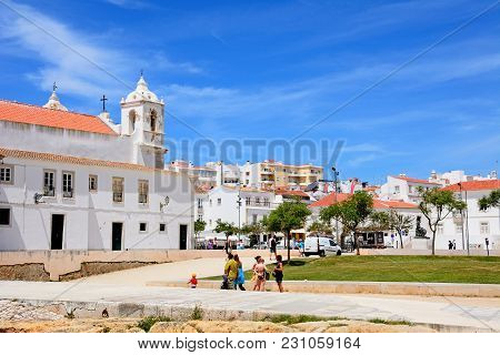 Lagos, Portugal - June 9, 2017 - Side View Of The Santa Maria Church In The Town Square With Tourist