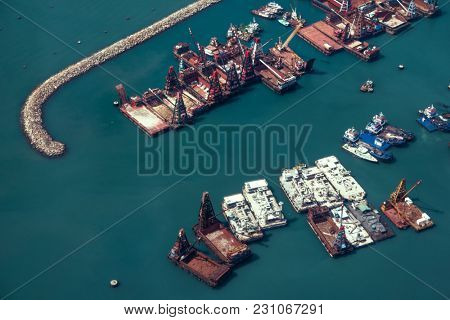 Hong Kong - October 2017: Elevated view of port with docking crane vessels.