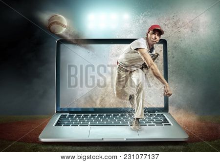 Baseball player in dynamic action around splash drops under stadium lights in evening match day.