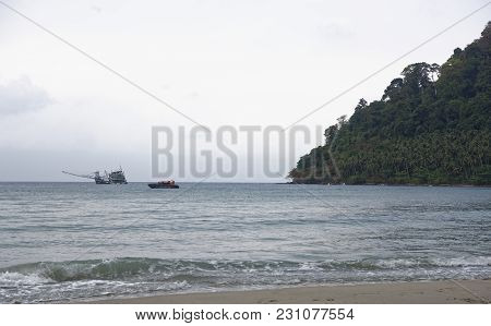 Ko Kut,thailand- February 26,2018: Boat And Fishing Boat Sail Near The Beach Of The Paradise Coconut