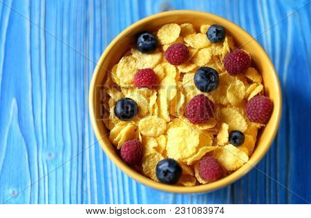 Cornflakes and different Berries - Blueberries and fresh Raspber