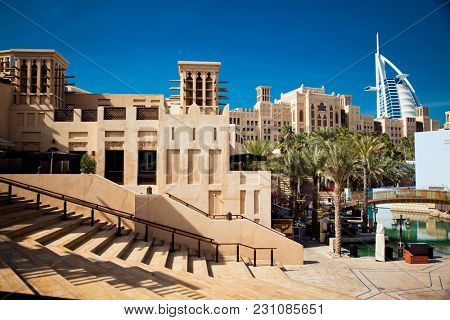DUBAI, UAE - FEBRUARY, 2018: View on Burj Al Arab, the world only seven stars hotel seen from Madinat Jumeirah, a luxury resort which include hotels and souk spreding across over 40 hectars.