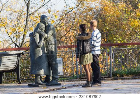 Kiev, Ukraine - October 18, 2017: Young Couple At The Monument To The Italian Prisoner Of War Luigi 