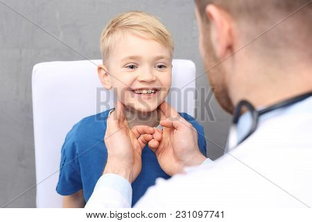 Otolaryngologist, A Child With A Doctor. The Pediatrician Examines The Child.