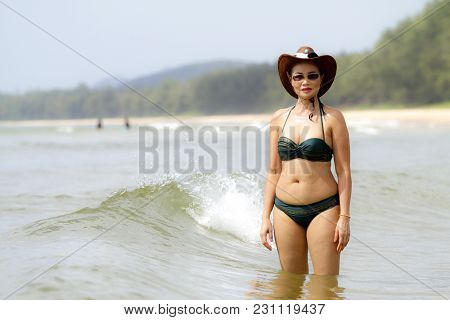 Woman Shape Sexy Show Bikini And Hat On Beach At Bang Beot Beach, Chumphon Province Thailand