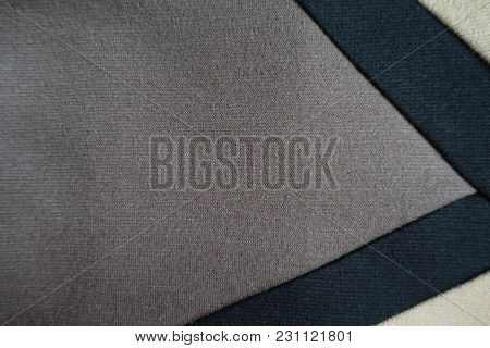 Gusset Of Grey Fabric Sewn To Beige And Black Fabric