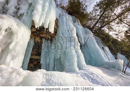 Ice Caves And Ice Curtains Form Along The Pictured Rocks Escarpment On Sand Point Road In Munising M