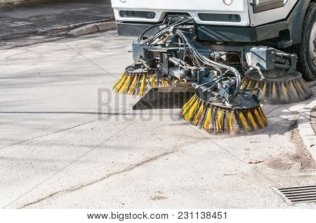 Sweeper Machinery. Street Sweeper Washing Garbage And Junk From Walkway And Road With Water And Clea