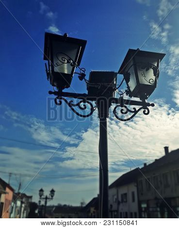 Street Lamp, City And Blue Sky With Clouds. Detail Fro Small Town In Serbia, Irig. Vintage Retro Lam