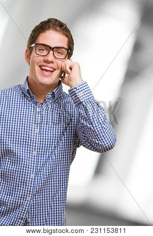 Happy Man Using Cell Phone against an abstract background