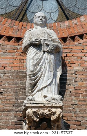 VERONA, ITALY - MAY 27: Saint Eufemia statue on the portal of Saint Eufemia Gothic-style, Roman Catholic church in Verona, Italy, on May 27, 2017.