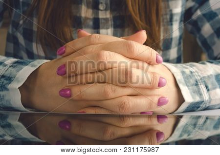Tablet Computer On Table And Crossed Female Arms. Student Girl Reading E-book On Her Tablet Computer
