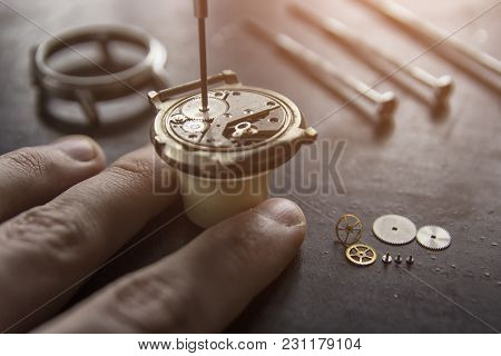 Watchmaker Is Repairing The Mechanical Watches In His Workshop