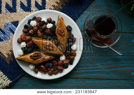 Azerbaijan National Pastry Pakhlava With Sweet Snack And Glass Of Traditional Black Tea On Wooden Ta