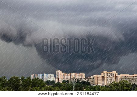 Tornado, Funnel Clouds During A Thunderstorm A Heavy Rain Downpour Over The City