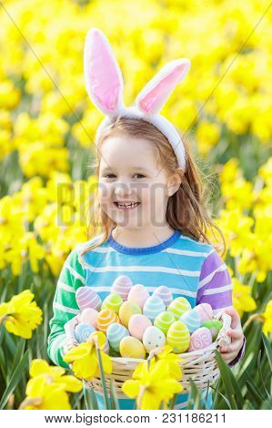 Child With Bunny Ears On Easter Egg Hunt