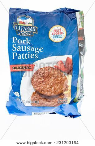 Winneconne, Wi - 27 February 2018: A Bag Of Tj Farms Select Pork Sausage Patties On An Isolated Back