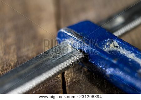 Carpenter's Clamp For Carpentry Work. Accessories In A Carpentry Workshop For Furniture Construction